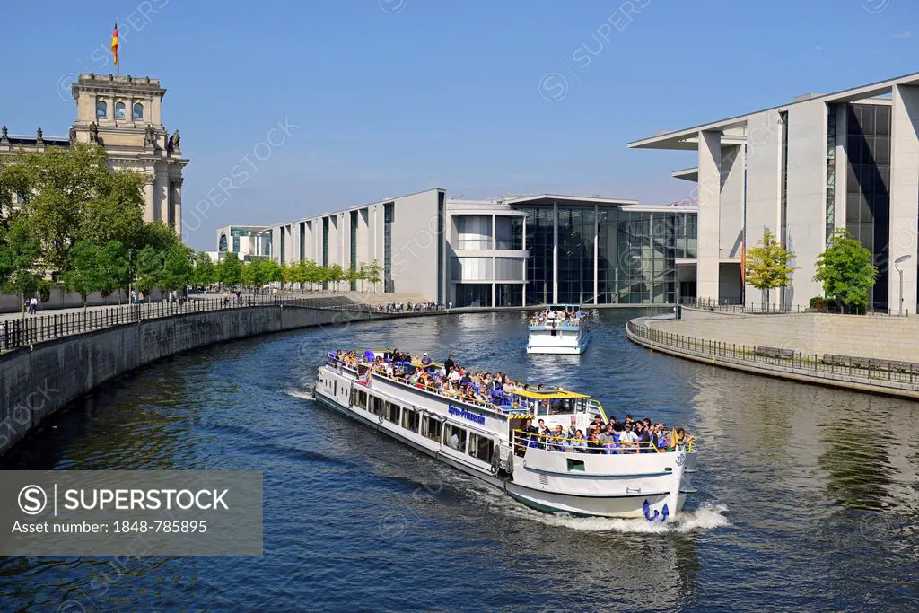 Passenger boat on the Spree River in the Government District, Reichstag building