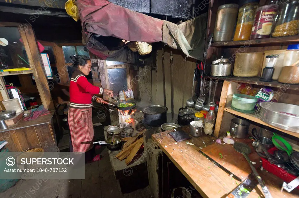 Local woman working in a typical Nepali kitchen