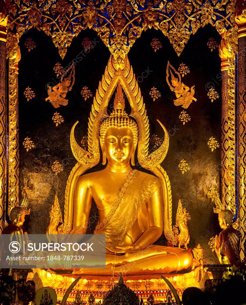 Golden Gautama Buddha Buddha in the posture of overcoming Mara, also called Mara submission, Buddha Phra Phuttha Chinnarat in the temple of Wat Phra S...