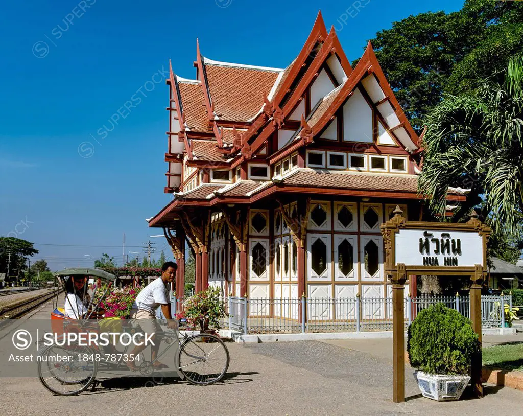 Royal Pavilion at Hua Hin Railway Station with a rickshaw driver