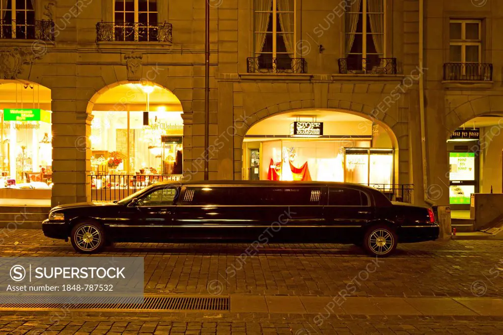 Black stretch limousine in Gerechtigkeitsgasse street at night