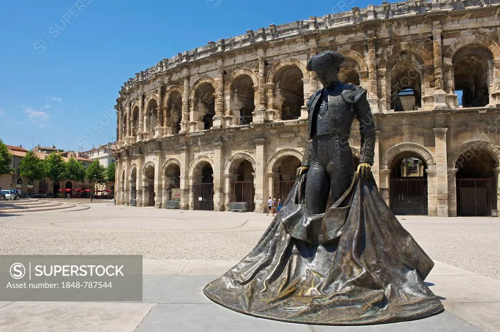 Statue of a bullfighter in front of the Roman amphitheatre