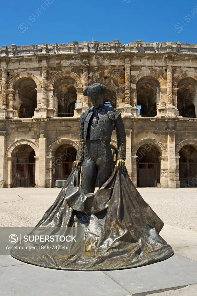 Statue of a bullfighter in front of the Roman amphitheatre