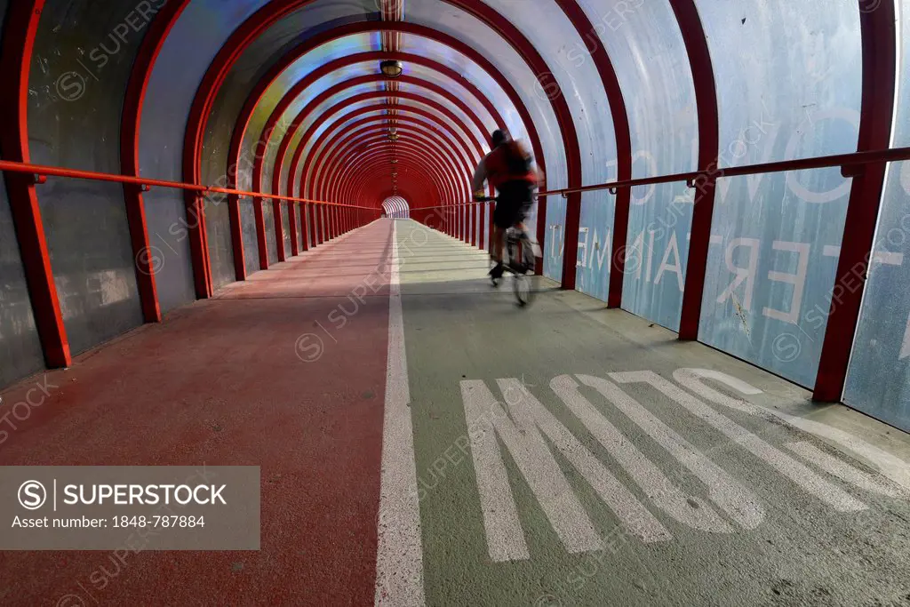 Cyclist is riding on Scottish Exhibition and Conference Centre Footbridge