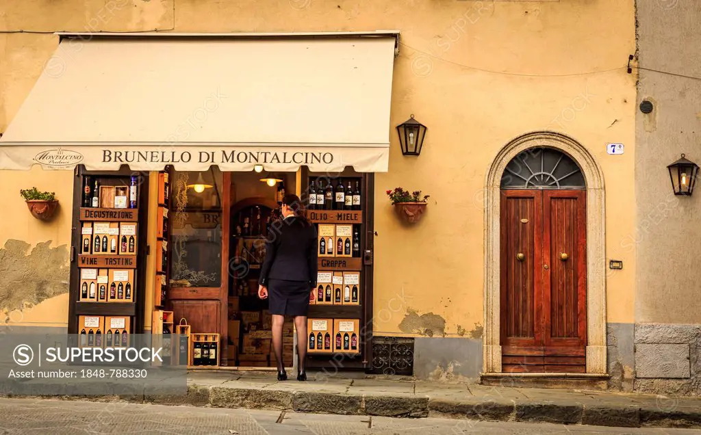Woman looking into a Brunello di Montalcino wine shop