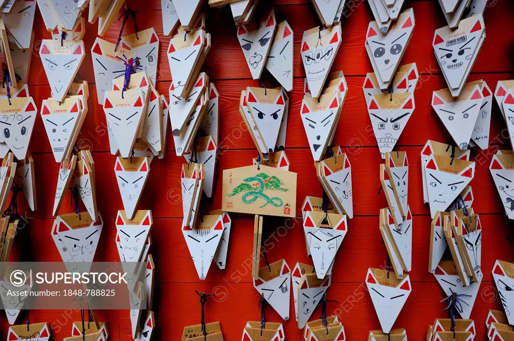 Foxes heads on sale as good luck charmes a shop, votive offerings, Fushimi Inari Taisha Shinto shrine