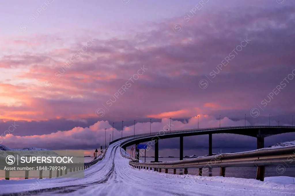 Bridge with snow-covered road in the evening light