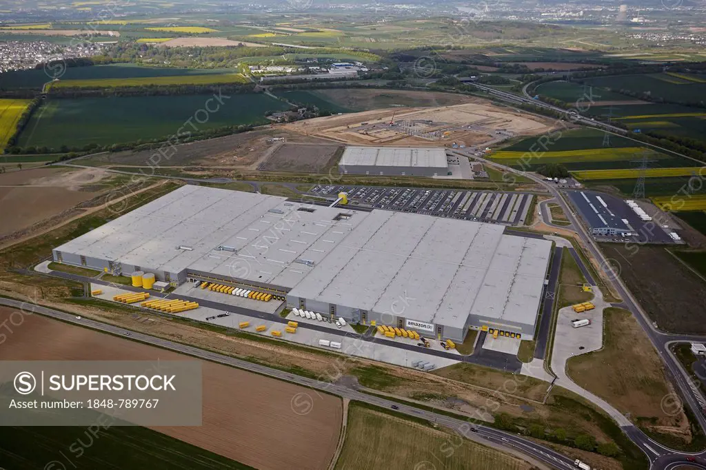 Aerial view, Amazon building and construction site of the Lidl central warehouse at the freight village on the A61 motorway
