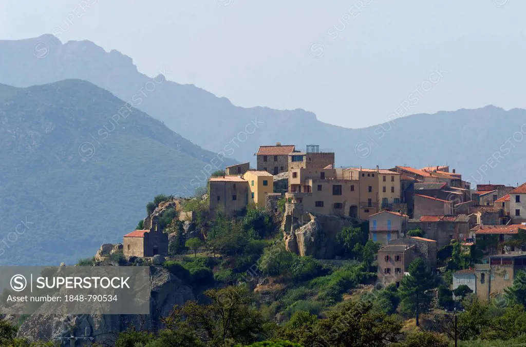 The small village of Montegrosso in front of the steep mountains of Corsica