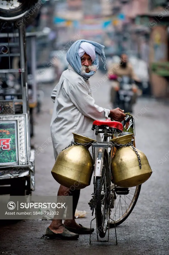 Milk seller with a turban and a bicycle