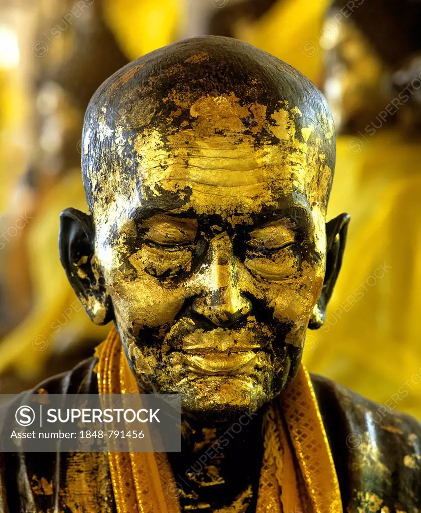 Gilded monk statue in the mountain temple of Wat Phra That Doi Tung