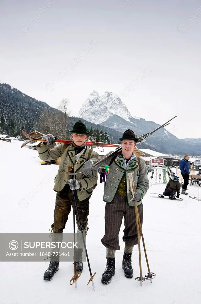 Skiers with equipment from the 1930s, Mt Alpspitze at back