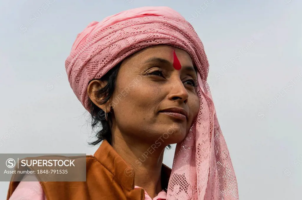 Portrait of a Sadhvi, holy woman, at the Sangam, the confluence of the rivers Ganges, Yamuna and Saraswati, during Kumbha Mela festival