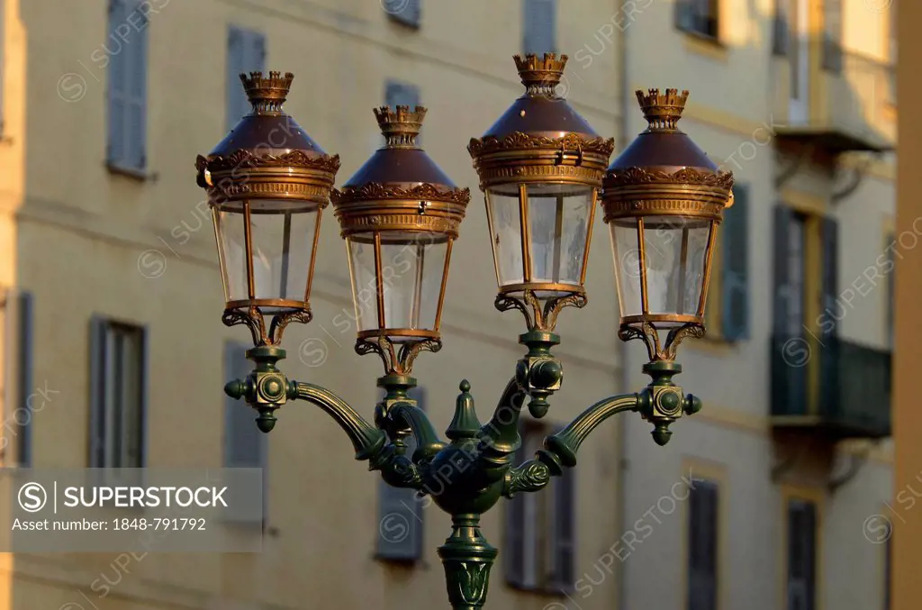 A glorious street lamp in Ajaccio and the facade of a house in the background illuminated by warm morning light. Ajaccio is the capital of the mediter...
