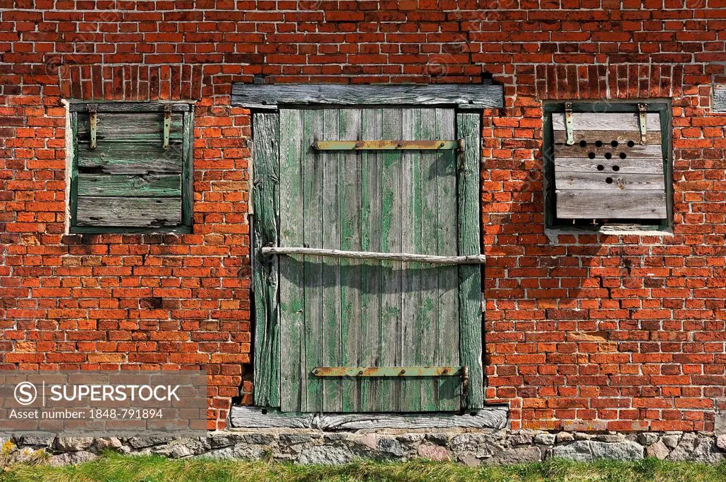 Door and window flaps of an old barn