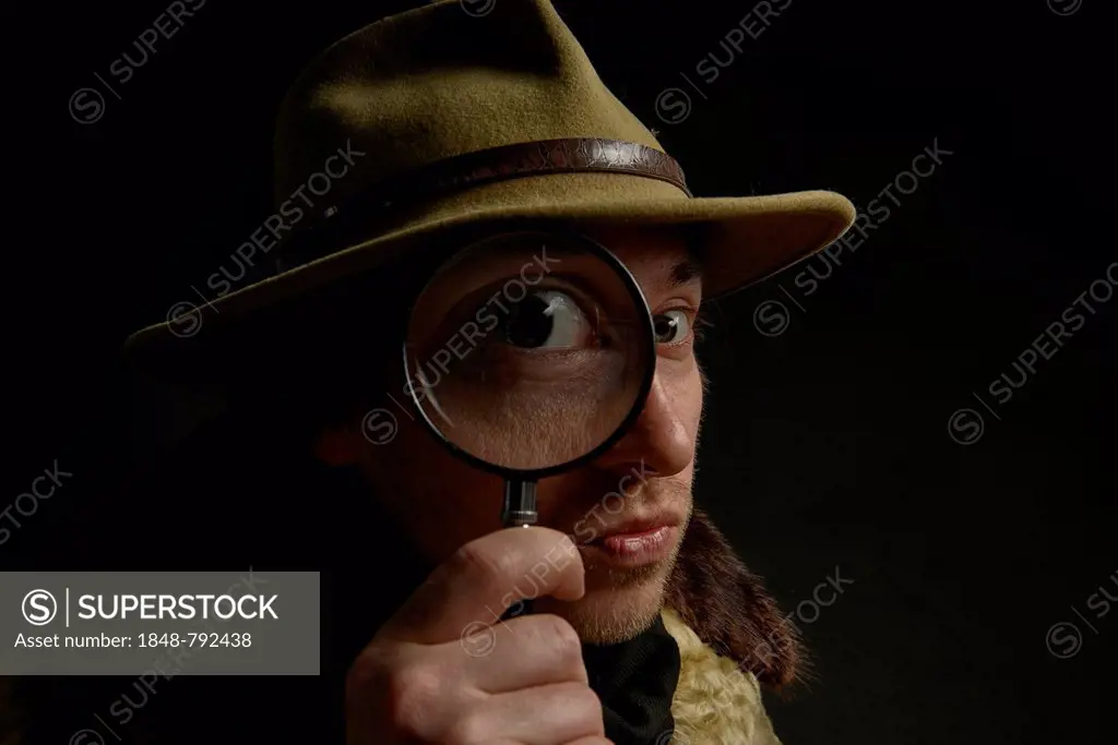 Man Holding A Stack Of Coins And Big Magnifying Glass In Hand High