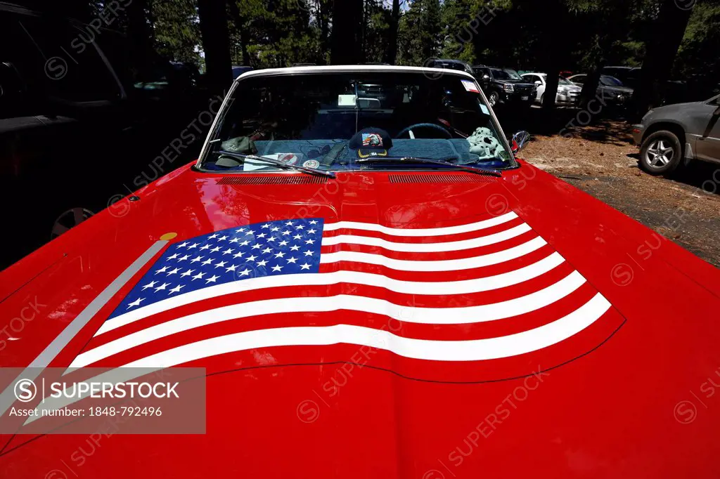 Red Plymouth Fury 67 with the U.S.-American flag painted on the hood, vintage car