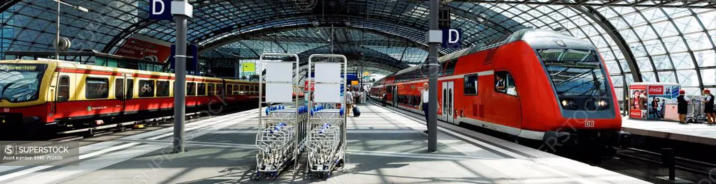 S-Bahn train meets Regional Express train, scene on the platforms of the upper level of the Berlin Central Station, Berlin, Germany, Europe