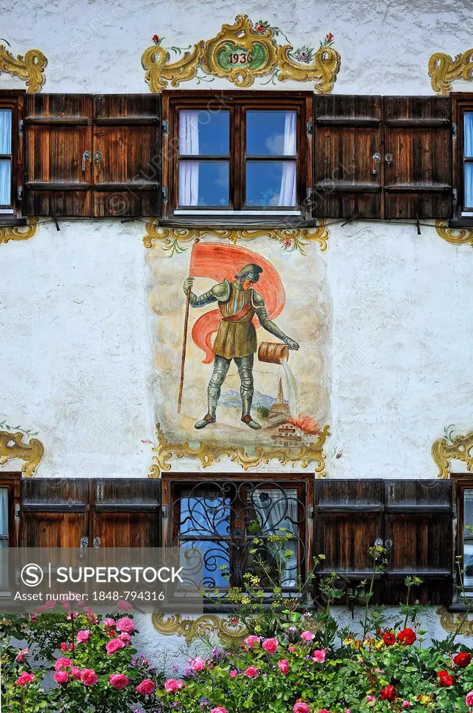 Windows with shutters, Lueftlmalerei mural of St. Florian from 1936 on the facade of a farmhouse