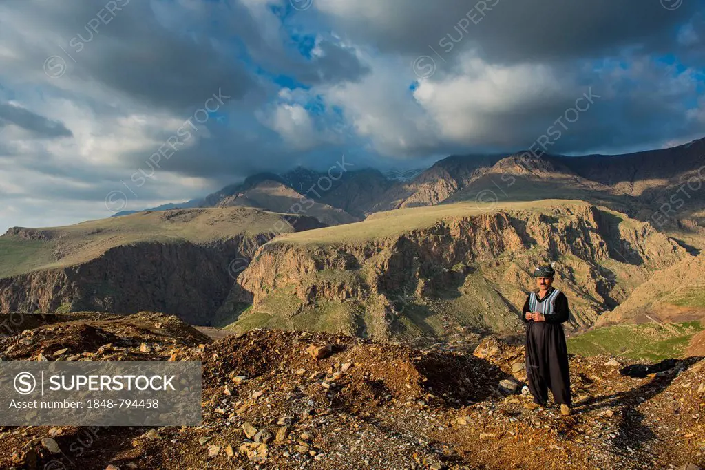 Kurdish shepherd standing on the edge of a canyon right above Ahmed Awa