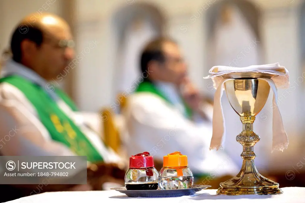 Catholic mass, chalice and containers with wine and water for the preparation of the celebration of the Eucharist
