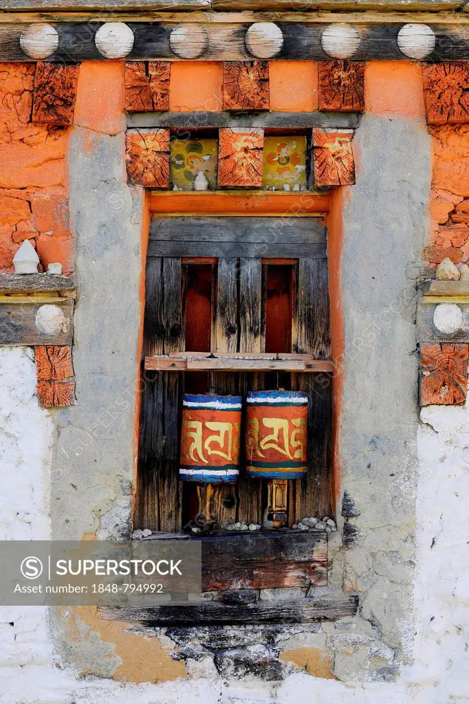 Prayer wheels in the outer wall of a temple