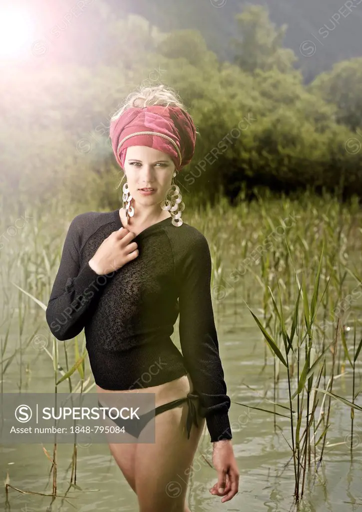 Woman standing between the reeds, fashion