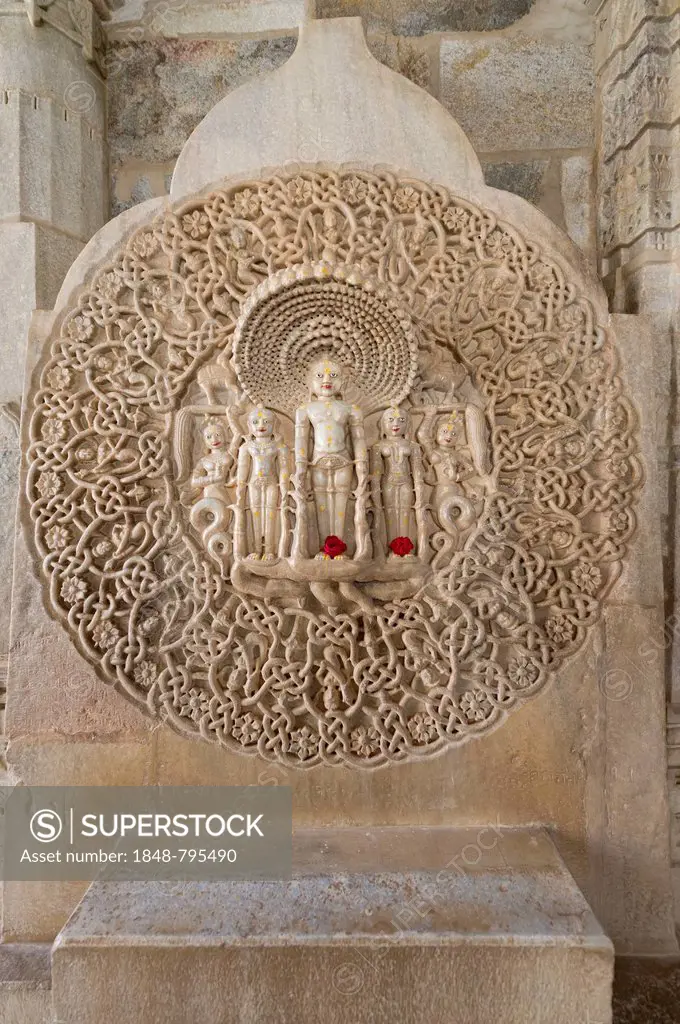 Tirthankar Parshvanat in the medallion protected by the thousand-headed serpent God Dharanendra against a powerful storm, marble temple, Adinatha Temp...