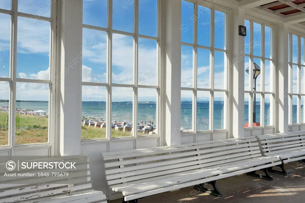 Looking through the window of the pavilion of the Kurhaus spa building towards the Baltic Sea and the beach, Baltic Sea resort town of Binz