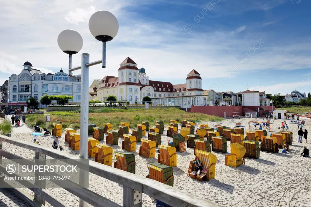 Roofed wicker beach chairs in front of the Kurhaus spa building, Baltic Sea resort town of Binz