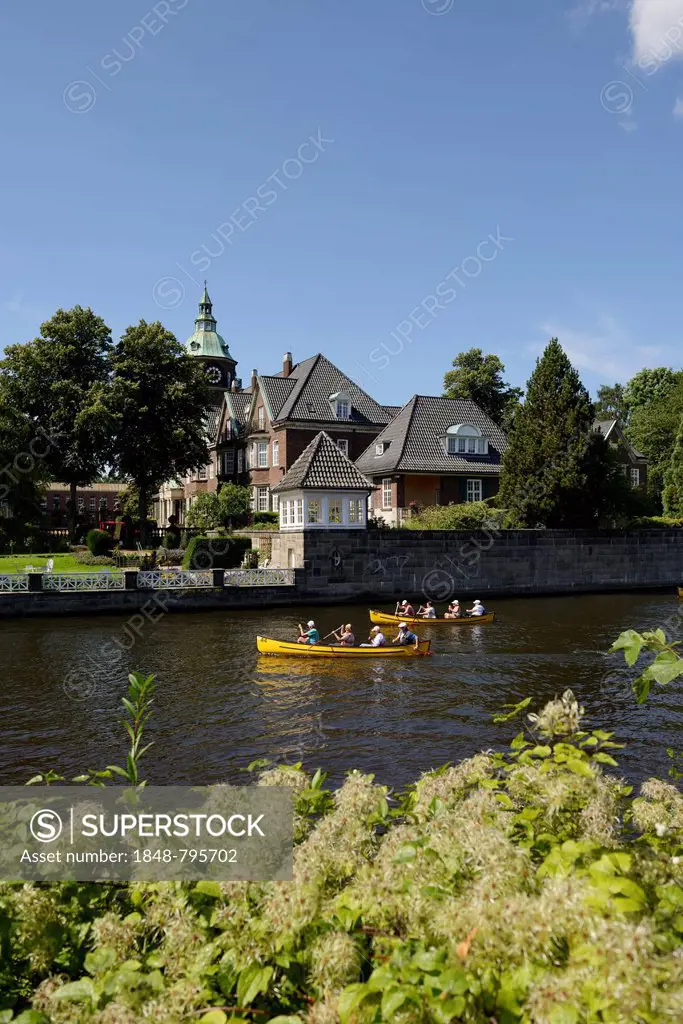 St. Johannis monastery, kayakers on the Alster river, seen from Leinpfad walkway