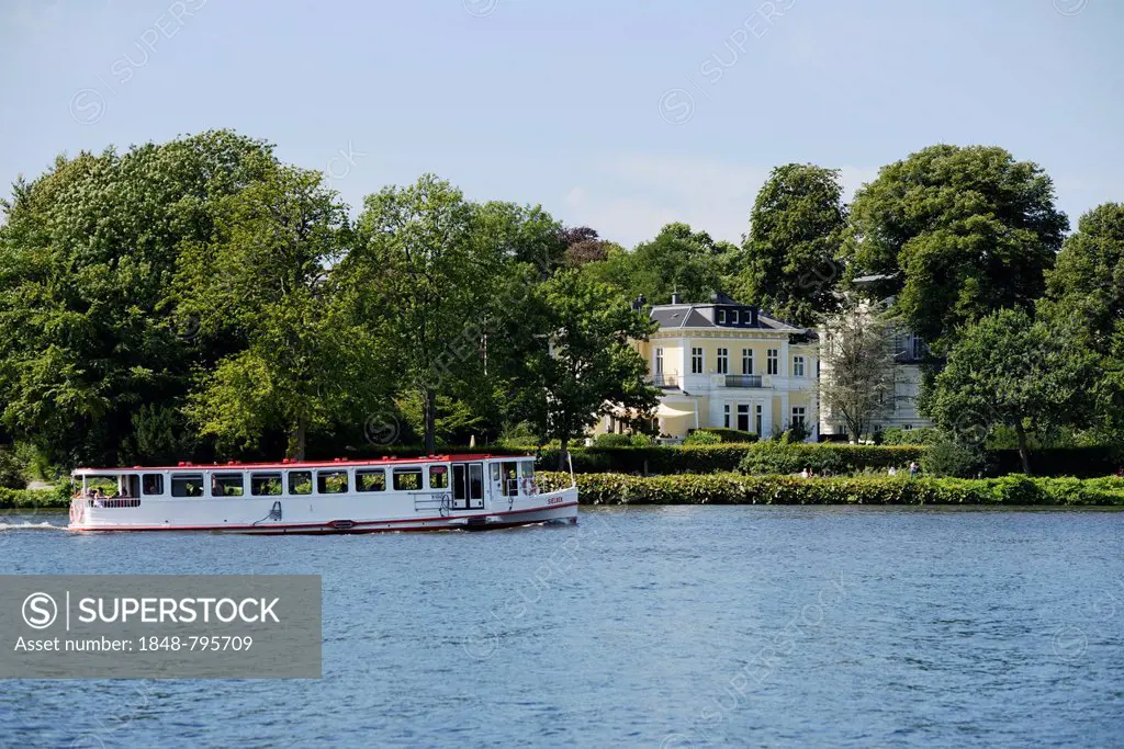 Alster river steamer on the Aussenalster or Outer Alster Lake, mansion at back