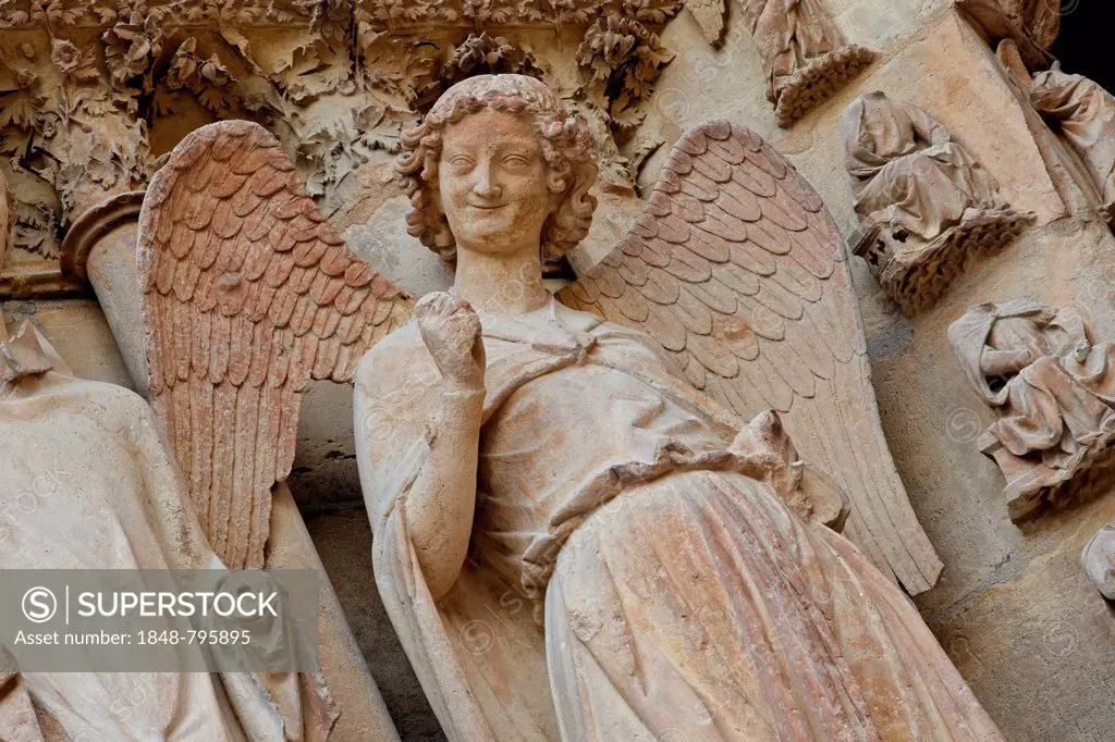 Angel on the left main portal, Cathedral of Notre Dame, Reims, Via Francigena, department of Marne, Champagne-Ardenne region, France, Europe