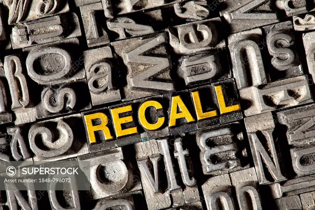 Old lead letters forming the word RECALL