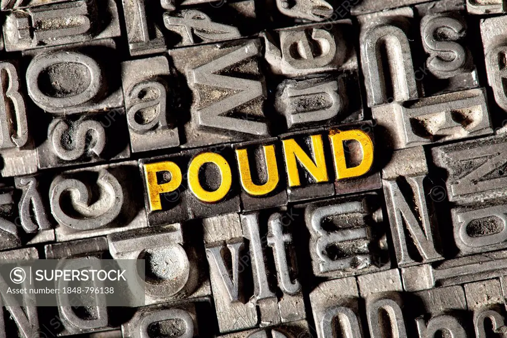 Old lead letters forming the word POUND