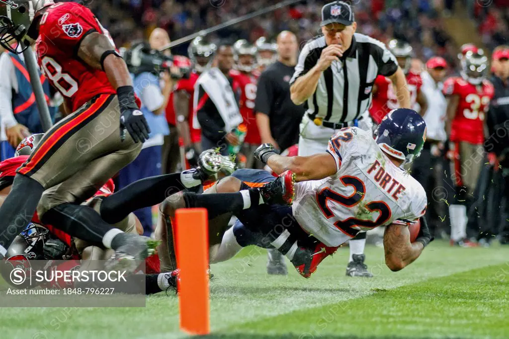 RB Matt Forte, #22 Chicago Bears, is tackled during the NFL International game between the Tampa Bay Buccaneers and the Chicago Bears on October 23, 2...