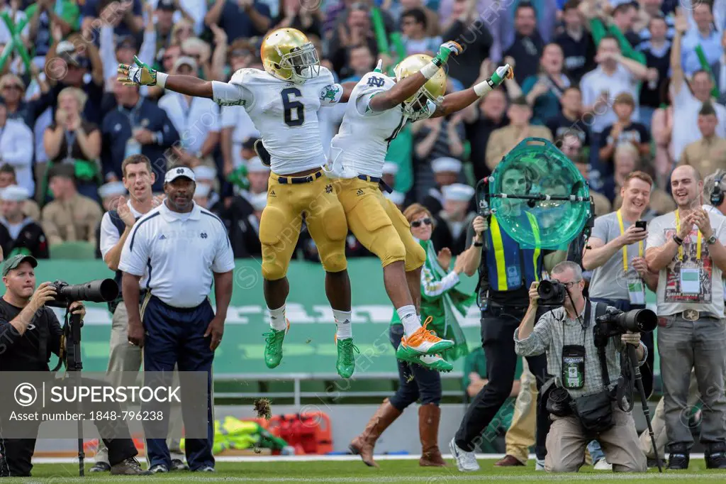 RB George Atkinson, #4 Notre Dame, and RB Theo Riddick, #6 Notre Dame, celebrate a touchdown during the NCAA football game between the Navy and the No...