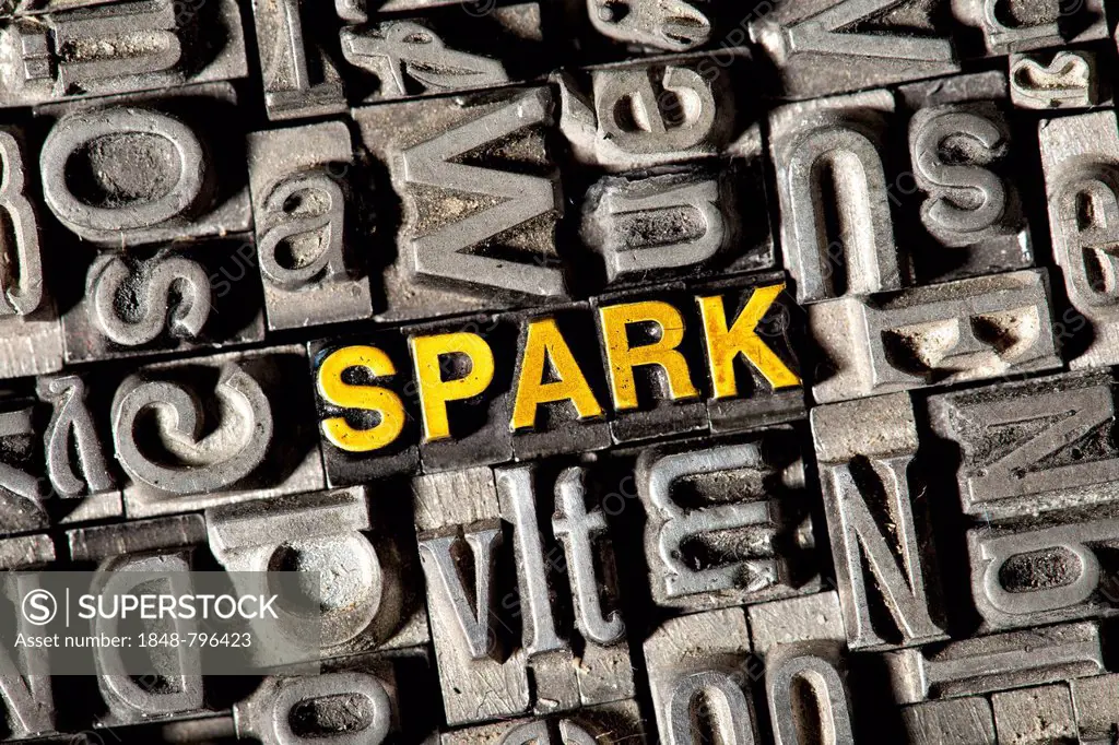 Old lead letters forming the word SPARK