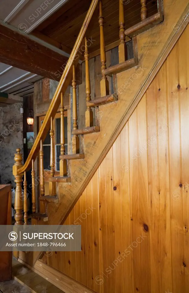 Pinewood staircase in an old Canadiana cottage style residential home, circa 1760, Quebec, Canada - This image is property released for book, calendar...