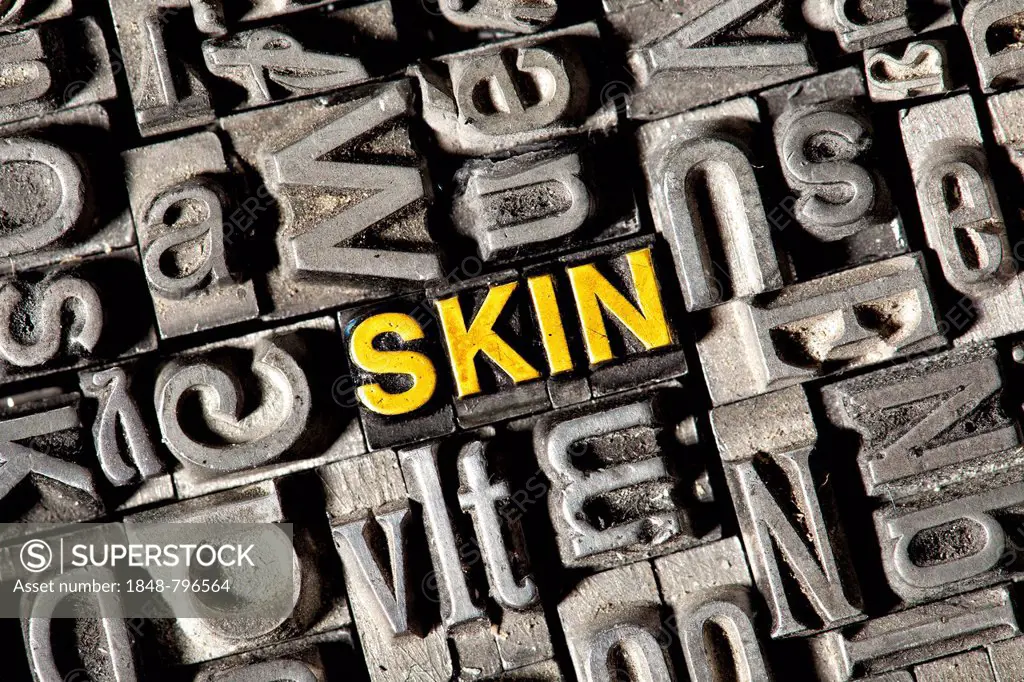 Old lead letters forming the word SKIN