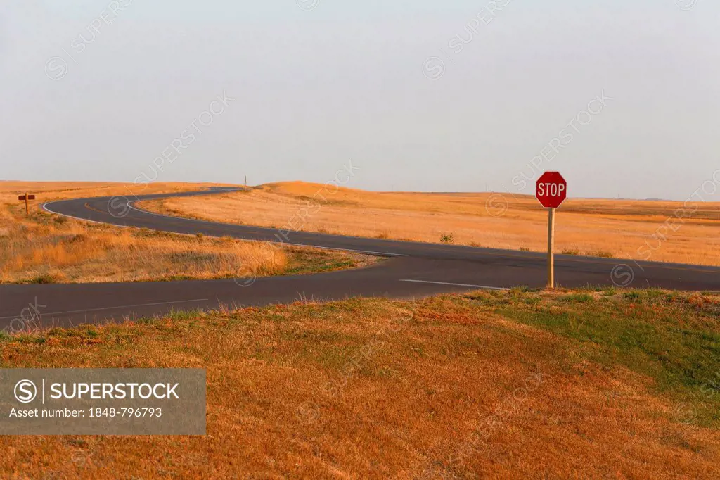 Stop sign on the prairie, Badlands National Park, South Dakota, USA
