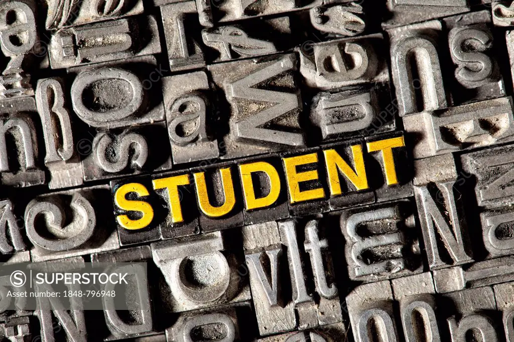 Old lead letters forming the word STUDENT