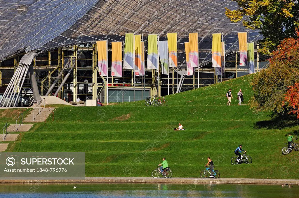 Pavilion-roof of the Olympic Hall, flags and visitors, Olympiapark, Munich, Bavaria, Germany, Europe