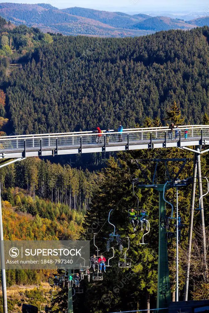 View of the landscape of the Hochsauerlandkreis district, with the Panorama-Erlebnis-Bruecke adventure bridge, a 20 meters high and 435 meters long me...