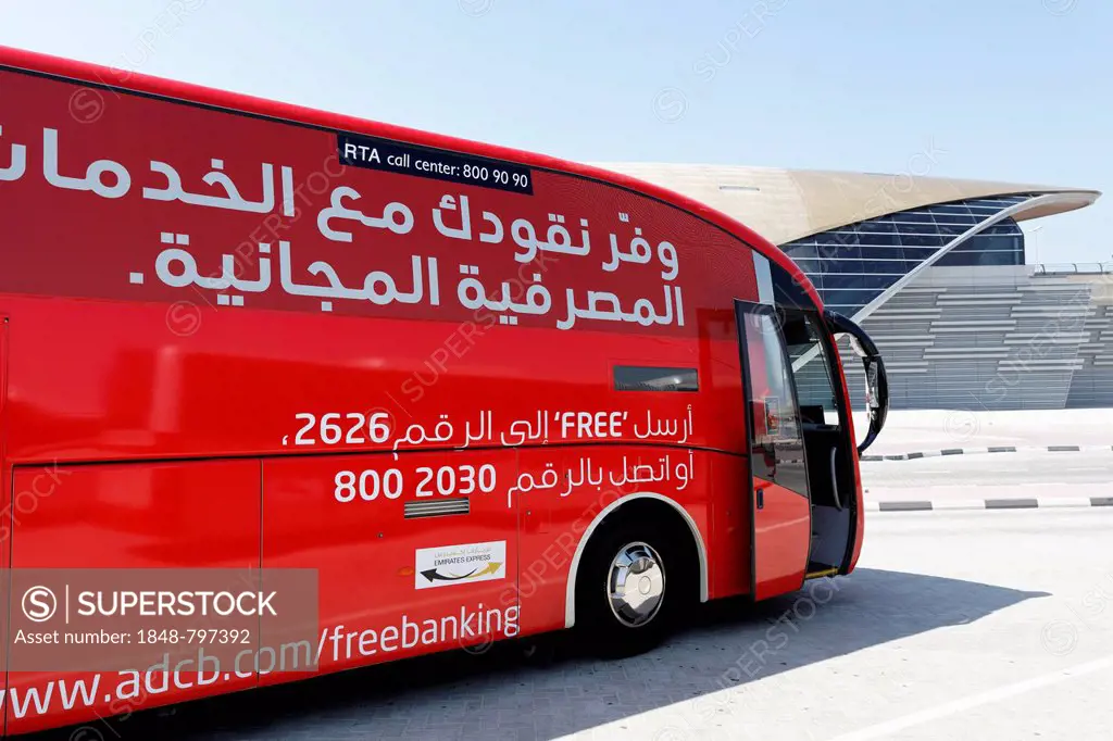 Modern coach with Arabic inscriptions, in front of Metro Station, Dubai, United Arab Emirates, Middle East, Asia