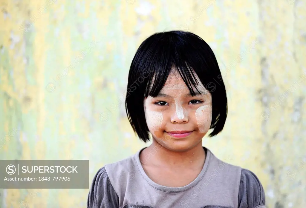 Girl with thanaka paste on her face, Mandalay, Myanmar, Burma, Southeast Asia, Asia