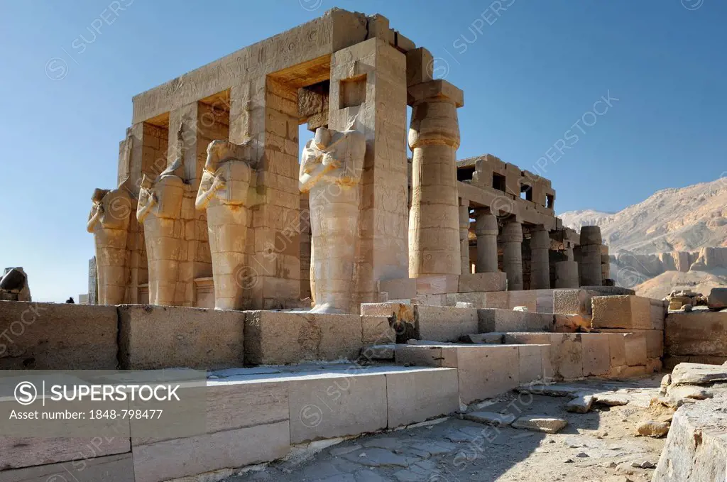 Facade with columns and Osiris statues in front of the Ramesseum, mortuary temple of Pharaoh Ramesses II