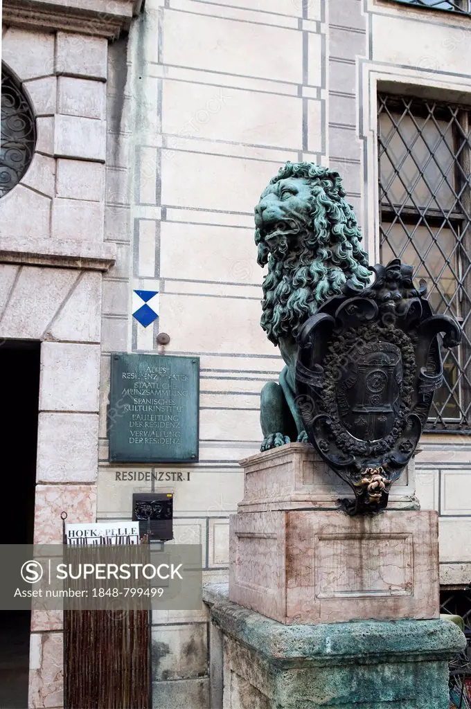 Lion sculpture in front of the Munich Residence, Residenzstrasse 1, the lower lip of the lion looking polished as it is rubbed for good luck, Munich B...