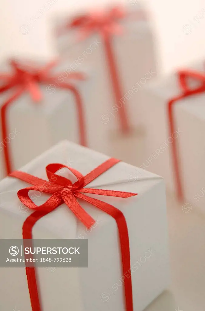White gifts with red ribbon