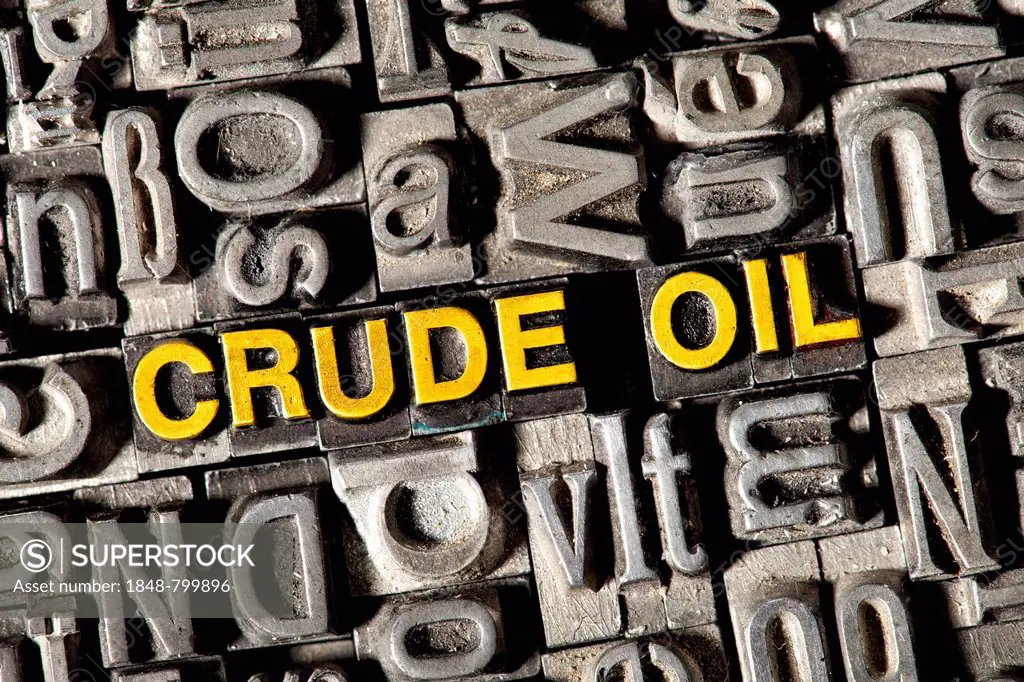 Old lead letters forming the words Crude Oil